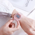 Transparent pink square digital sports watch worn on wrist with LED display - Pink