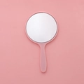 Mini round handheld makeup mirror in cute pink plastic frame with ergonomic handle - 5.5x10cm / Pink