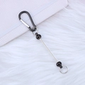 Black D-shaped carabiner bead bar keychain with black spherical beads on a white background - Black