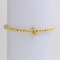 Golden beaded stretch bracelet with a polished letter Q pendant for women - Gold Q