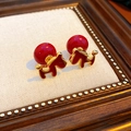 Close-up of vintage animal-shaped earrings in red and gold finish with flower details - Drip Oil Zircon Pony Pearl (Gold-Red)