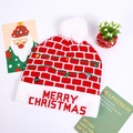 Detail of red Christmas knit hat with LED light switch and Merry Christmas text - Red Brick Merry Christmas