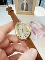 Detail of snake-head gold watch on wrist with brown leather strap and white dial - Brown White Dial (45157)