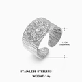 Anillo de ojo turco de acero inoxidable plateado con textura radial y banda ajustable - Abierto Ajustable / Color Acero