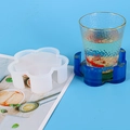 Flower-shaped silicone mold for DIY resin coasters showing blue floral resin finished piece - Flower Coaster Box Mold