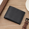 Classic black bifold men's wallet with lychee pattern on a wooden background - Black