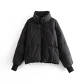 Detailed view of women's black puffer jacket with stand-up collar and elastic cuffs - XS / Tops / Black