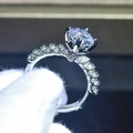 Elegant twisted band moissanite ring with round solitaire diamond in four-prong setting - US 7 / White