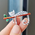 Cute white spotted cat enamel brooch on an orange branch with green leaves accessory - Xz0273-2 White