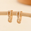 Macro detail of champagne gold infinity earrings with micro-pave white zircon crystals - EH211 Infinity Symbol