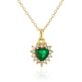 Detail of 18K gold necklace featuring a heart-shaped emerald green gemstone with halo diamonds - Green