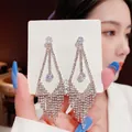 Detailed close-up of long silver tassel earrings with shimmering crystals on S925 card - Silver Inverted Triangle Full Rhinestone Long Tassel Earrings (E0064银)