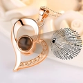 Rose gold heart projection necklace showing I Love You in 100 languages for Valentine - Rose Gold Heart Necklace