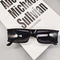 Chic black square frame sunglasses with thick temples on a decorative book background - Black
