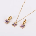 Detailed shot of golden necklace and earrings set featuring purple crystal butterflies - Purple Butterfly Style (Gold Chain)