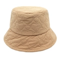 Detailed view of beige corduroy bucket hat with quilted heart patterns and knit texture - Khaki