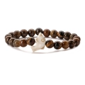 Handmade tiger eye beaded bracelet featuring a white dolphin charm on a white background - Tiger Eye Stone Bracelet