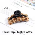 Macro detail of leopard print plush balls and pearl banana clip hair accessory - Light Coffee Leopard Claw Clip