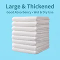 Stack of thickened white disposable face towels with waffle texture on a blue background - Economy Bulk (Thickened) / Face Towel