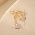 Macro shot of gold bow heart charm with dimensions 2.5cm by 2cm for DIY jewelry - Zircon Heart Style MYYX00634 / Gold