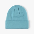 Light blue double-layer knitted beanie hat with classic folded cuff for winter warmth - Teal Blue
