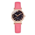 Detail of pink quartz watch with starry blue dial and rose gold numerals - Rose Red