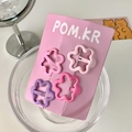 Set of 4 cute pink and purple gradient flower hair clips on a branded display card - Flower