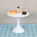 White single-tier metal cake display stand with decorative base on blue plaid cloth - Medium 25CM / White