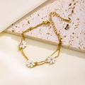 Elegant gold double-layered chain bracelet featuring white daisies and gold beads décor - Double-layer Daisy White Shell Bracelet (7964) / Gold