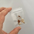 Golden leaf earrings with brown beads in a clear portable PVC zip lock jewelry bag - 50 Micron 5x7cm Resealable / 100 Pcs/Pack
