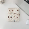 Close-up of quilted cream pouch with cute bread dog pattern and soft textured finish - Bread Doggy
