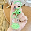 Green rabbit oil liquid quicksand keychain with bell and metal clasp on wooden desk - Green Unicorn Letter Beads