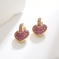 Detail of gold-plated hoop earrings featuring micro-paved purple heart zircons - Red