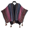 Ethnic knit poncho featuring colorful wave patterns and fringe trim on a hanger - Cardigans / Blue Pink