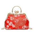 Elegant red floral brocade shell bag with gold handle and pearl clasp detail - Red