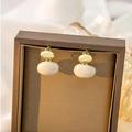 Elegant vintage pearl star earrings with golden metal finish on jewelry box display - Oval Marble Texture Retro Studs (E4437-2)