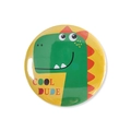 Detail shot of a round tinplate badge featuring a green dinosaur and Cool Dude text - One Size / Yellow Base Green Dinosaur (COOL DUDE)