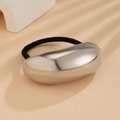 Elastic hair tie featuring a large smooth silver metal oval accent and black cord - Large Oval Style / Silver