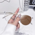 Blue light blocking glasses with transparent frames and slim gold metal temples - Photochromic Brown / Transparent Gold Frame