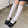 White knee-high lace socks with mesh bow detail paired with black Mary Jane shoes - One Size / Ribbon Frill White