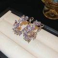 Macro detail of silver butterfly earrings with sparkling purple and clear zircon stones - Purple Butterfly Ear Hoop (Silver)