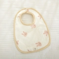U-shaped cotton baby bib featuring cute pink rabbit print and soft yellow piping - Pink Rabbit