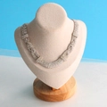 Silver rhinestone choker necklace displayed on a high-end wooden mannequin stand - Small Beige Velvet