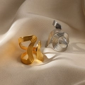 Detailed view of gold and silver wavy textured rings on champagne satin fabric - JZ7146 Streamlined Overlap / Silver