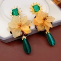 Macro detail of vintage floral earrings with green teardrop pendants and yellow flowers - Gold Yellow 3D Flower Green Pendant Style