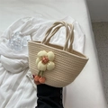 Handmade cream woven tote bag featuring a 3D floral accent and orange tassels - Off White