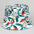 Reversible bucket hat with white orange and leaf print pattern for summer sun protection - M / Leaf Green