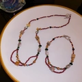 Macro detail of bohemian ceramic flower and multi-stone beaded necklace with silver OT clasp - Reddish Brown Set/Bracelet+Necklace