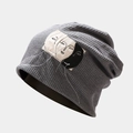 Detail shot of grey waffle knit slouchy beanie featuring minimalist face patch - M (56-58cm) / Gray