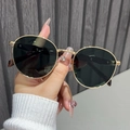 Close-up of retro round metal sunglasses with gold frames and dark polarized lenses - Gold Frame Dark Green Lenses